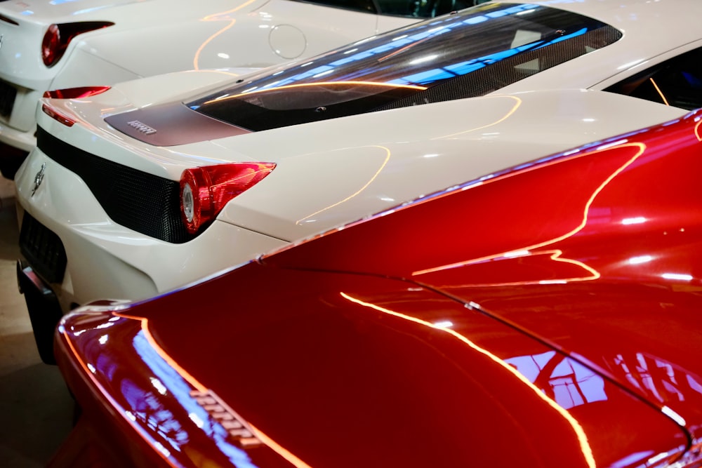 a close up of a red and white sports car