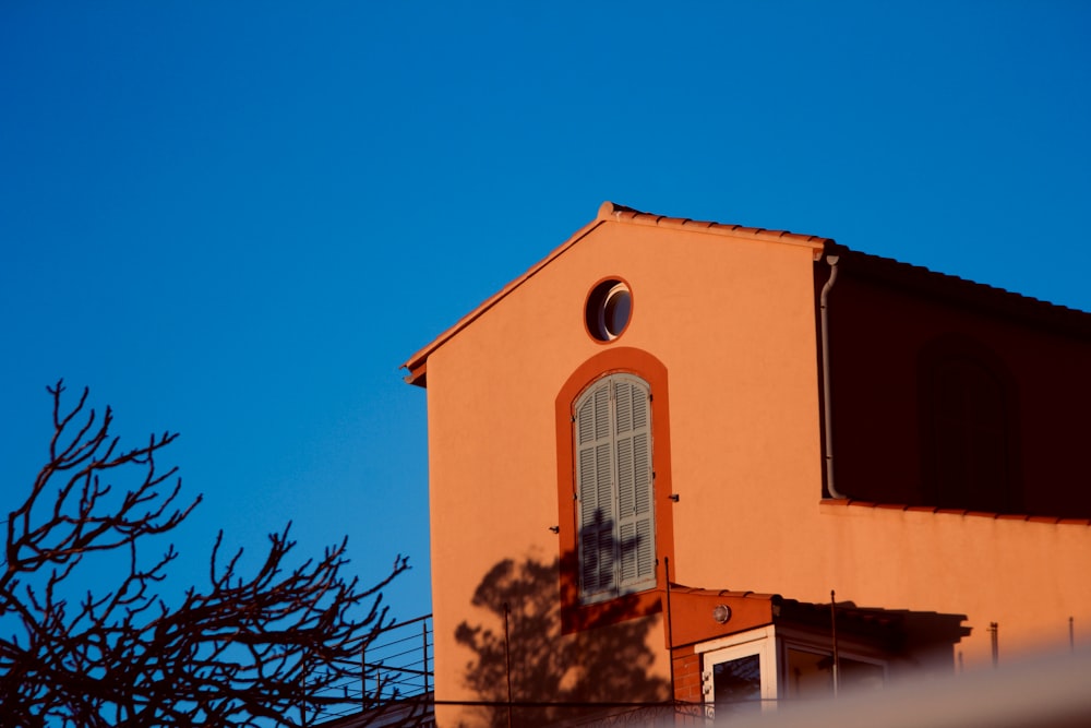 a building with a clock on the side of it