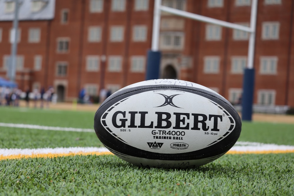 a close up of a rugby ball on a field