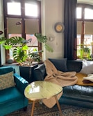 a living room filled with furniture and lots of windows