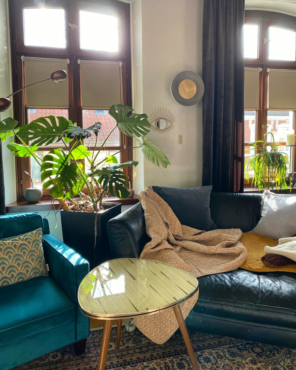 a living room filled with furniture and lots of windows