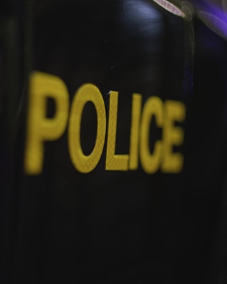 a close up of a police badge on a black background