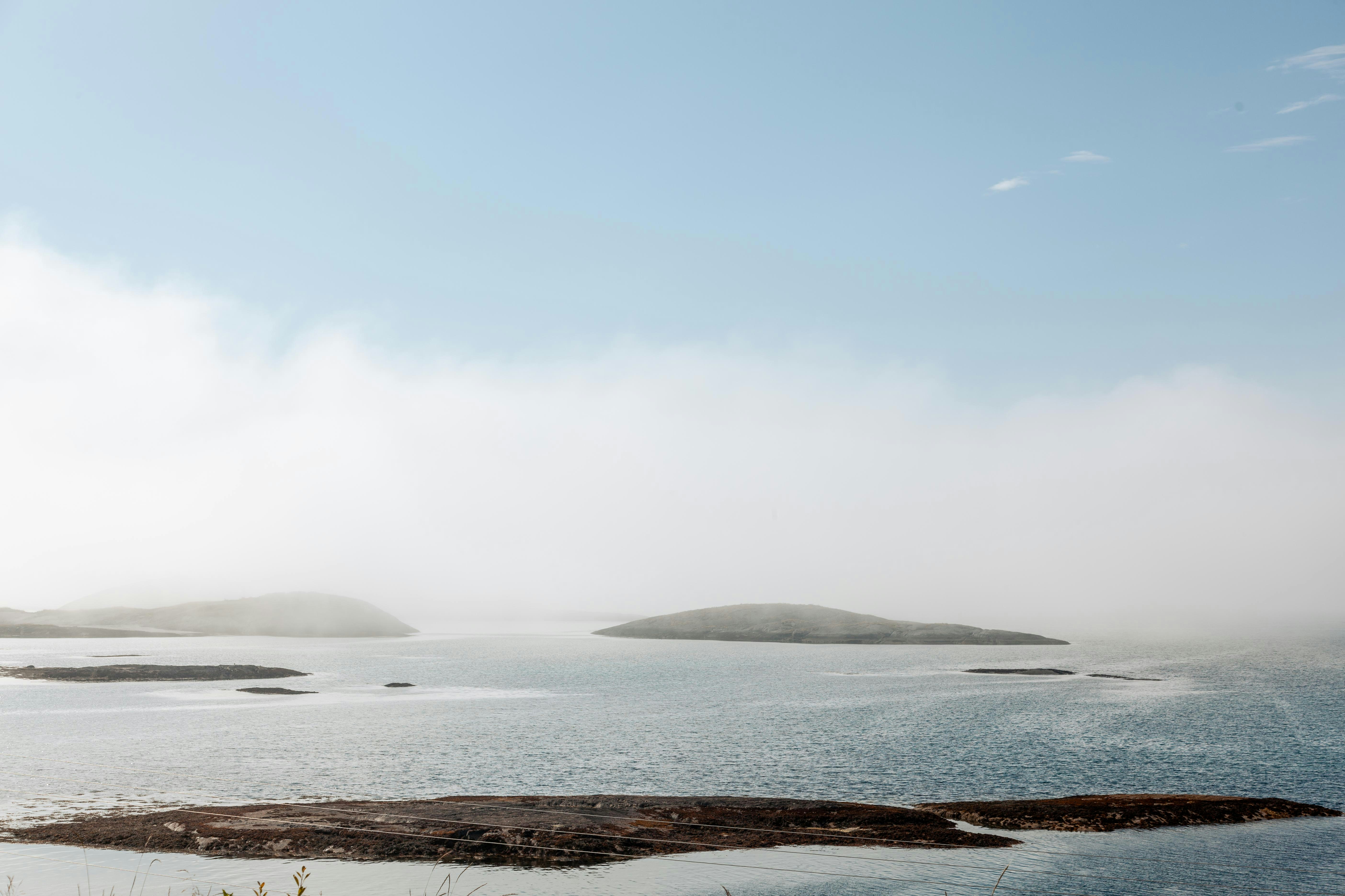 a large body of water surrounded by land, 