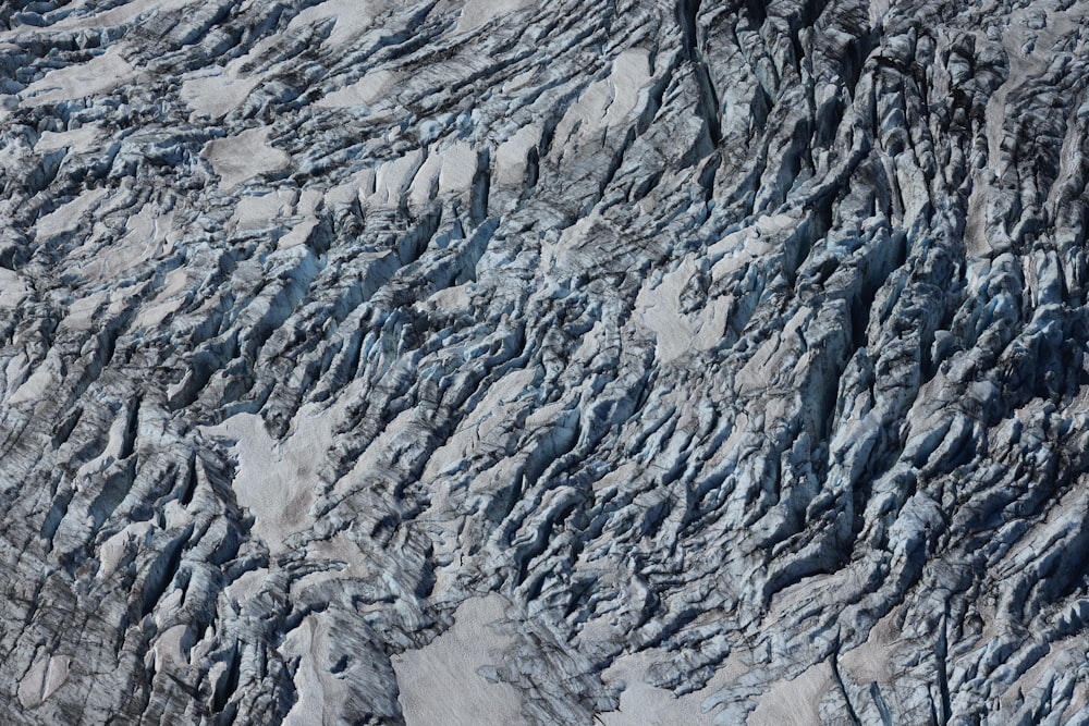 an aerial view of a glacier with snow on it