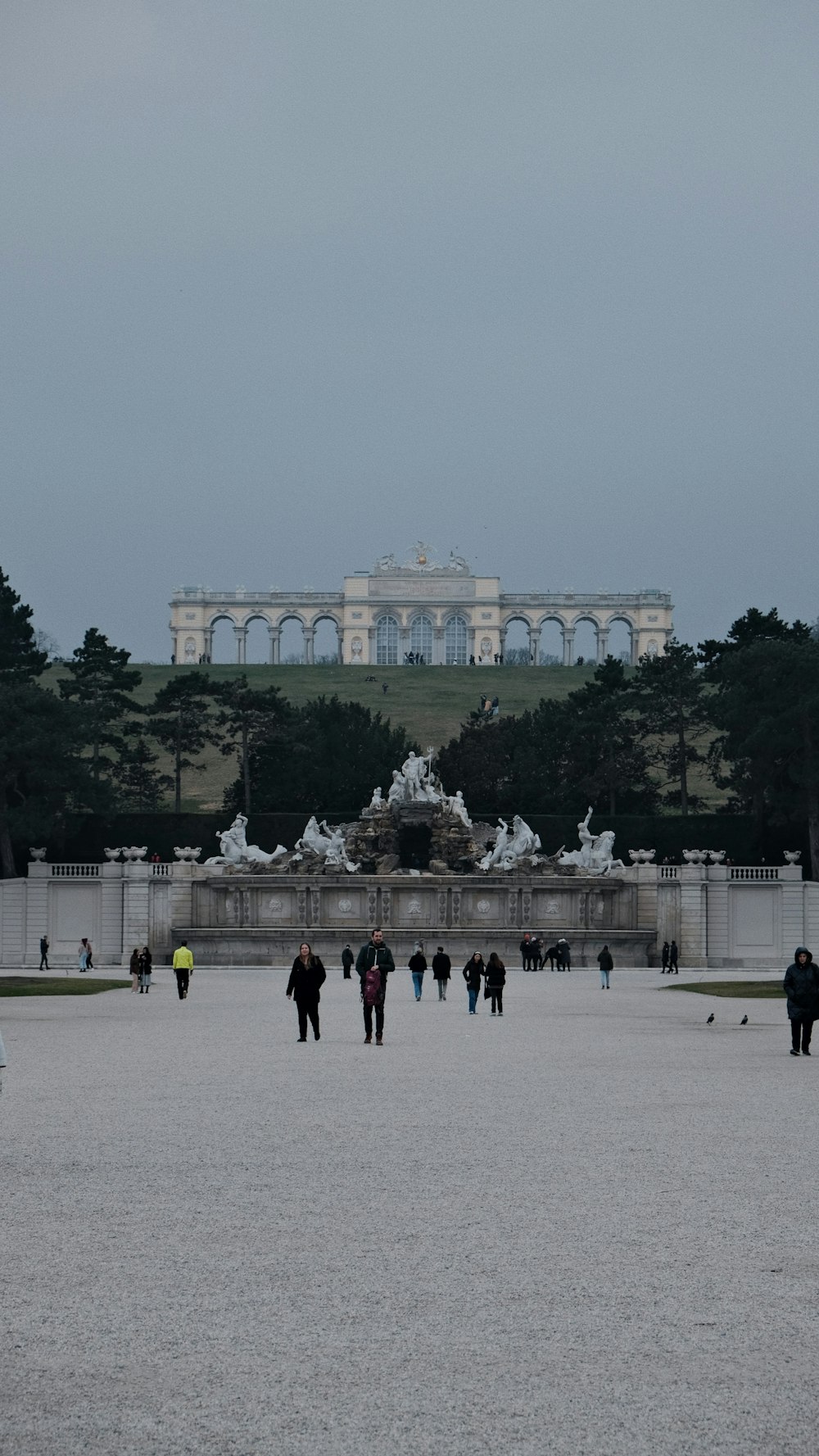 a group of people walking in front of a building