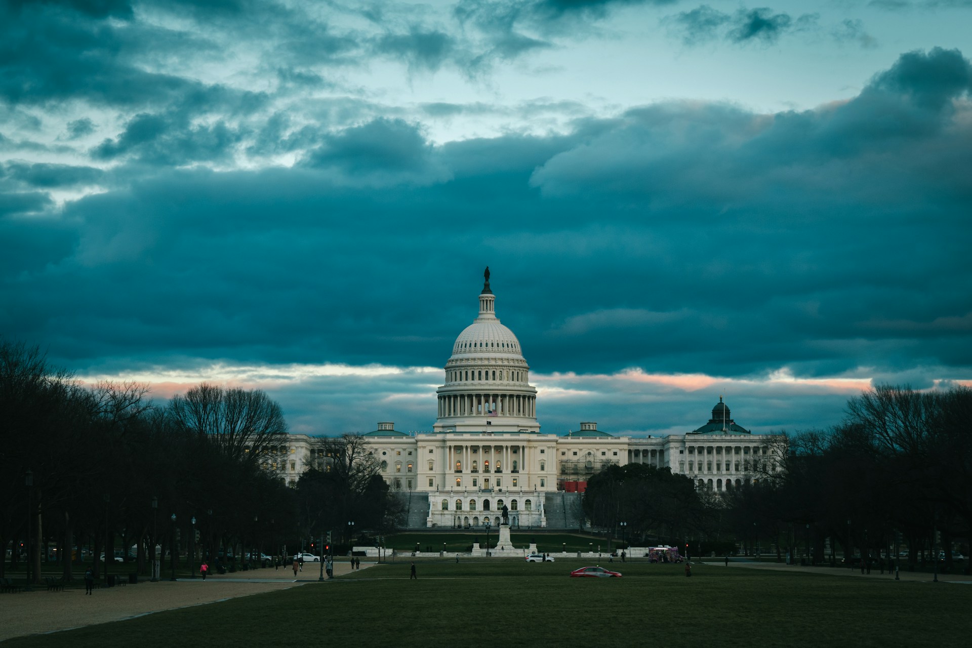 the capitol building in washington dc under a cloudy sky