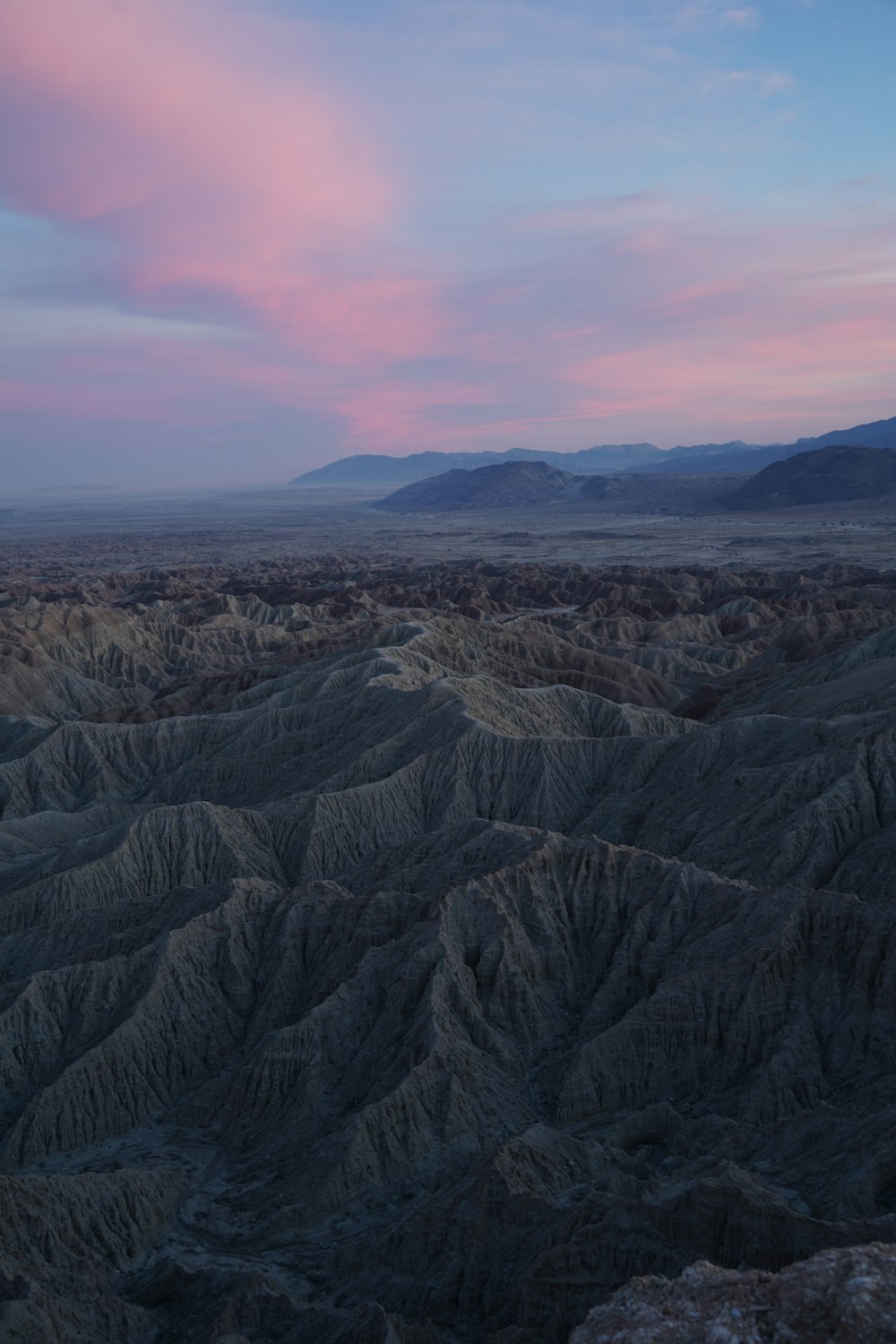 a view of a mountain range at sunset