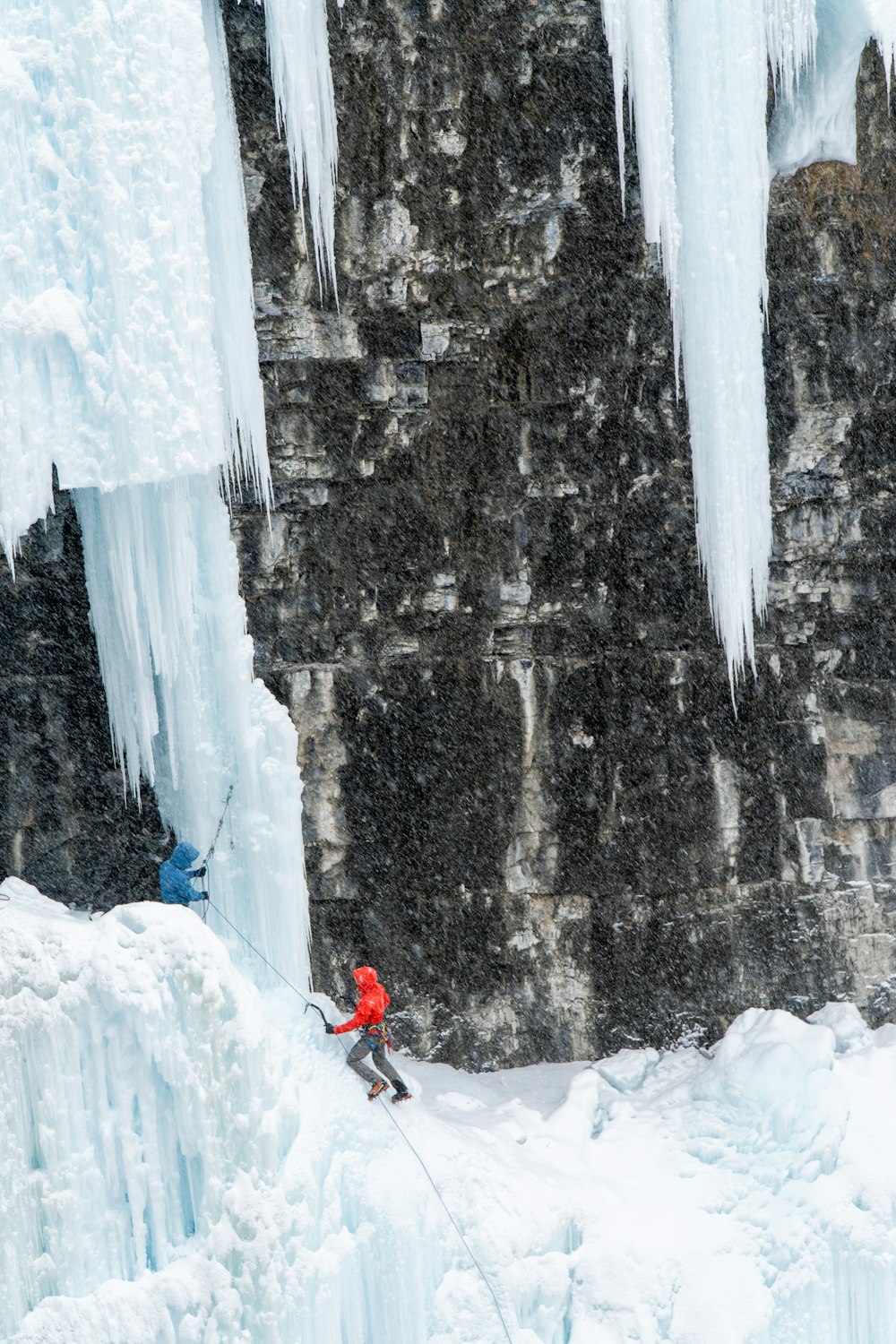 a person on skis in front of ice formations