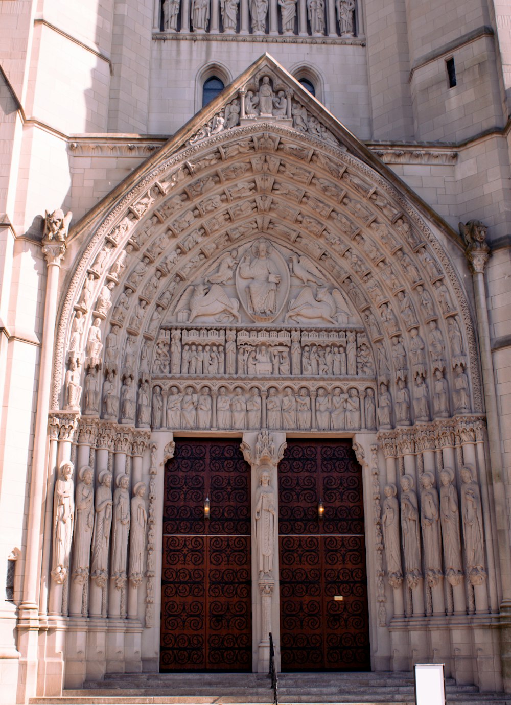 a large stone building with two large doors