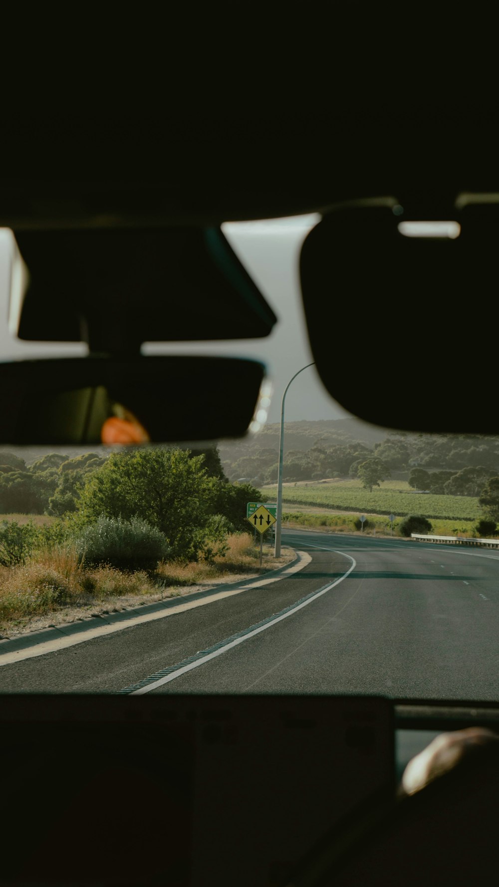 a view from inside a vehicle of a road