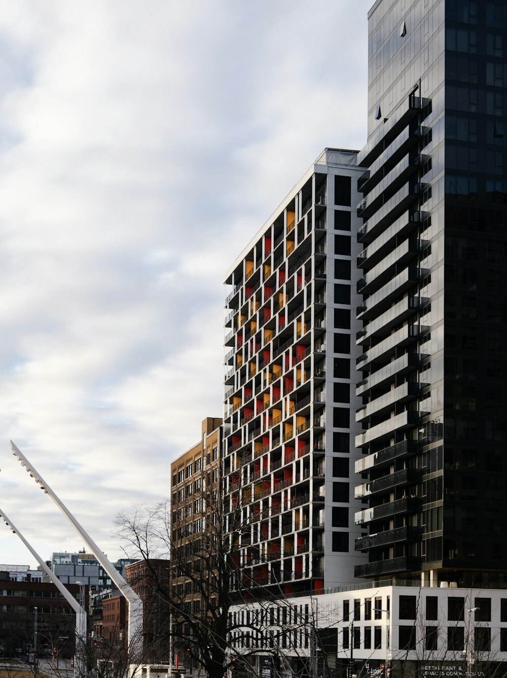 a very tall building sitting next to other tall buildings