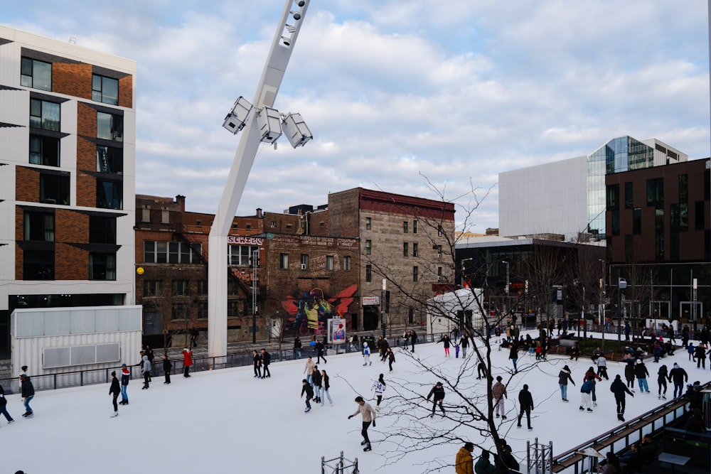 a group of people skating on an ice rink