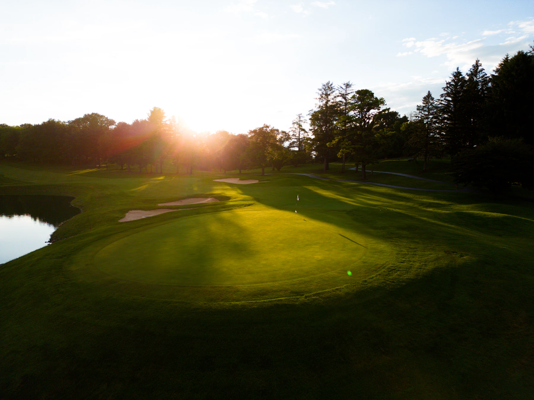 Sun setting over the course