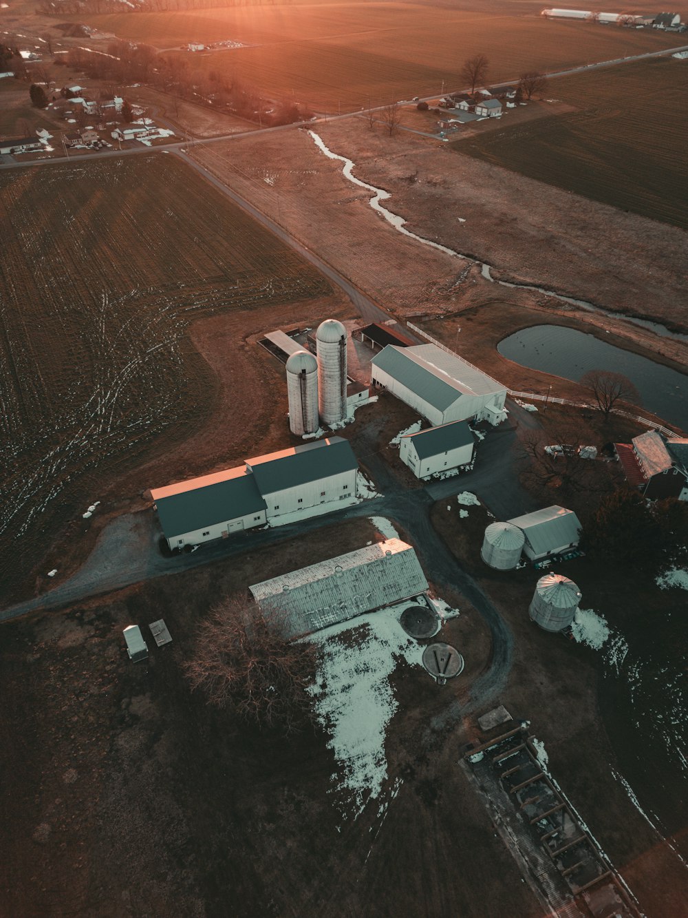 an aerial view of a farm in the country