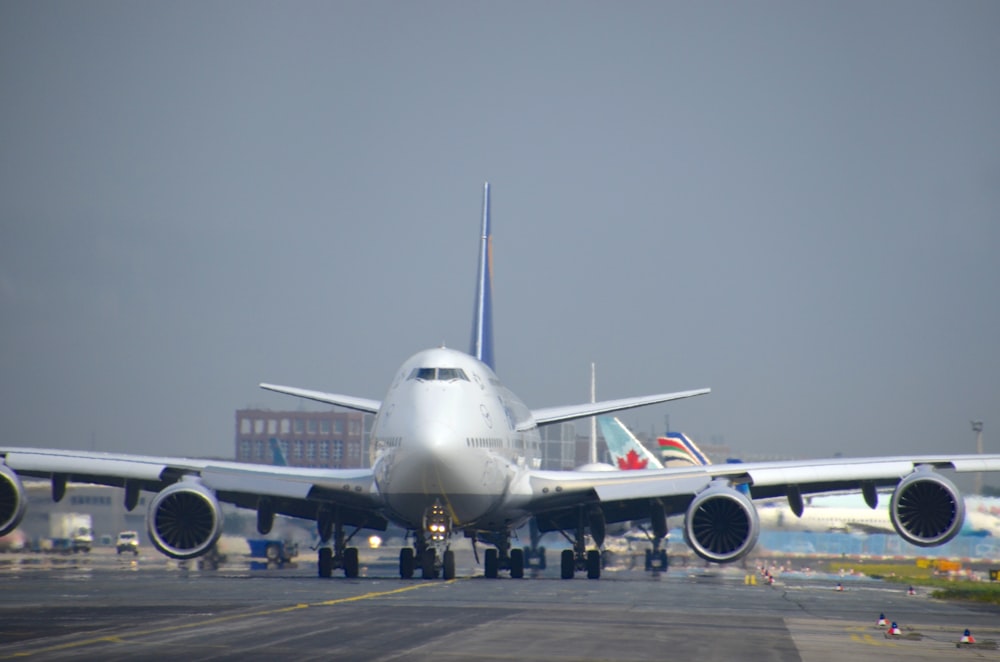 a large jetliner sitting on top of an airport tarmac