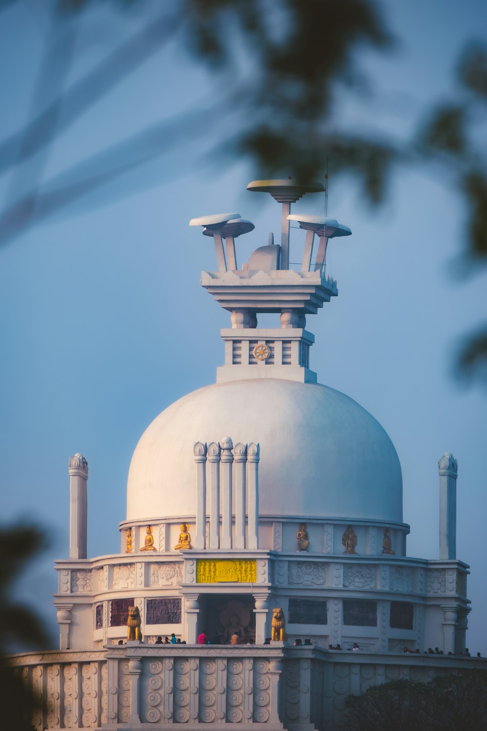 a large white building with a clock on top of it