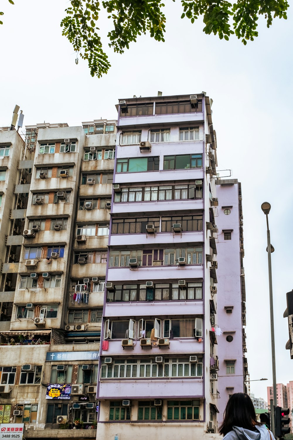 a tall building with lots of windows and balconies