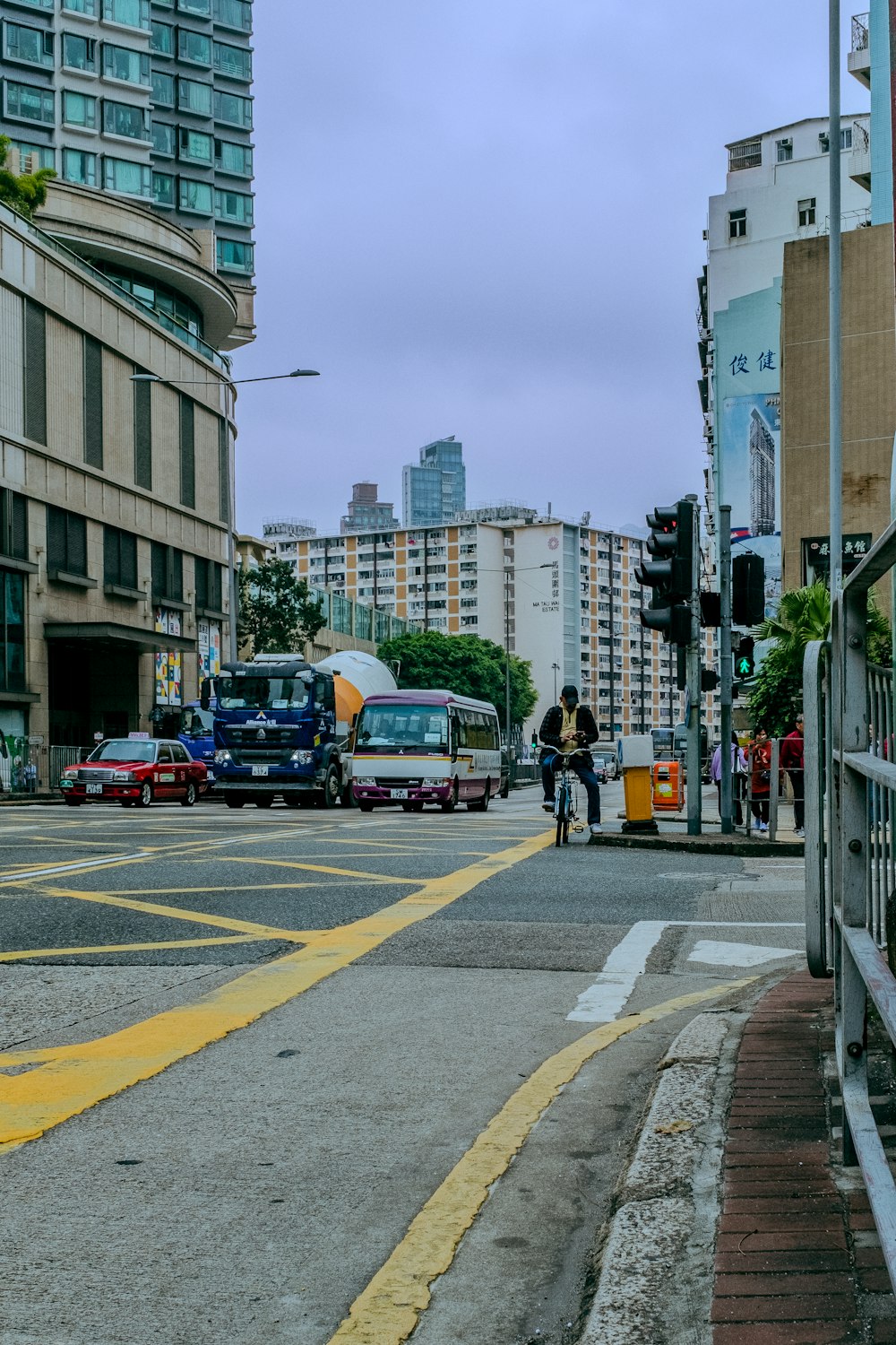 a city street with cars and a bus