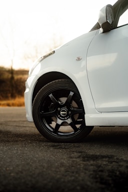 a white car parked on the side of the road