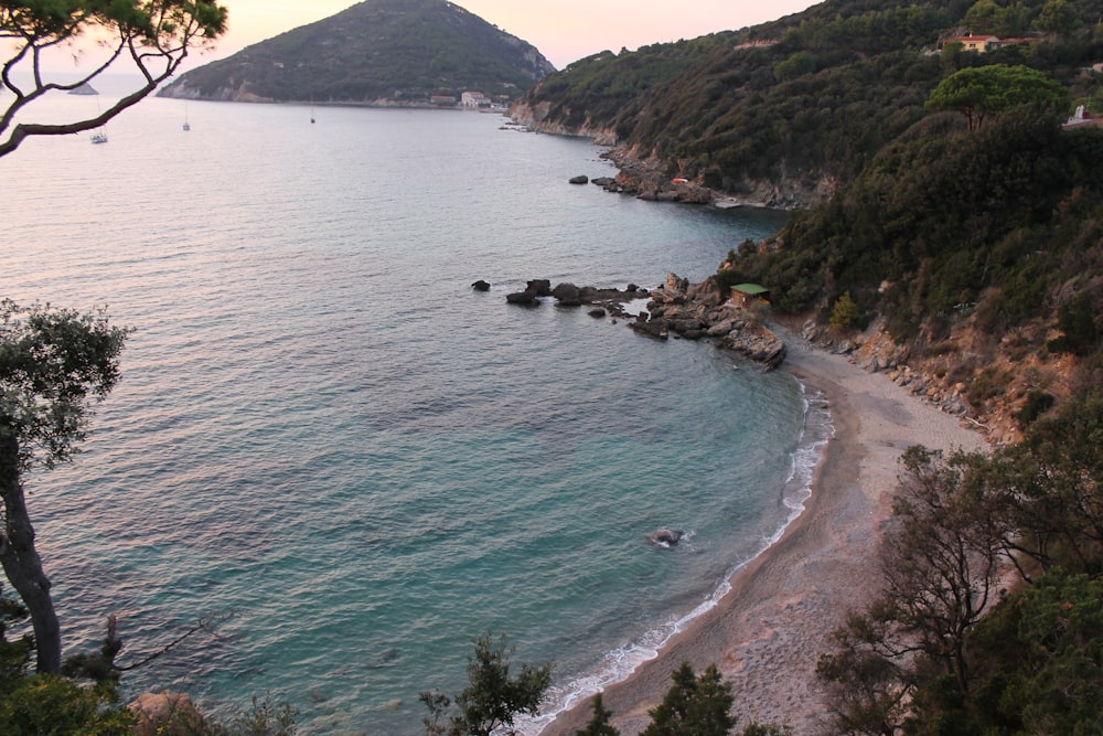 a view of a beach with a mountain in the background