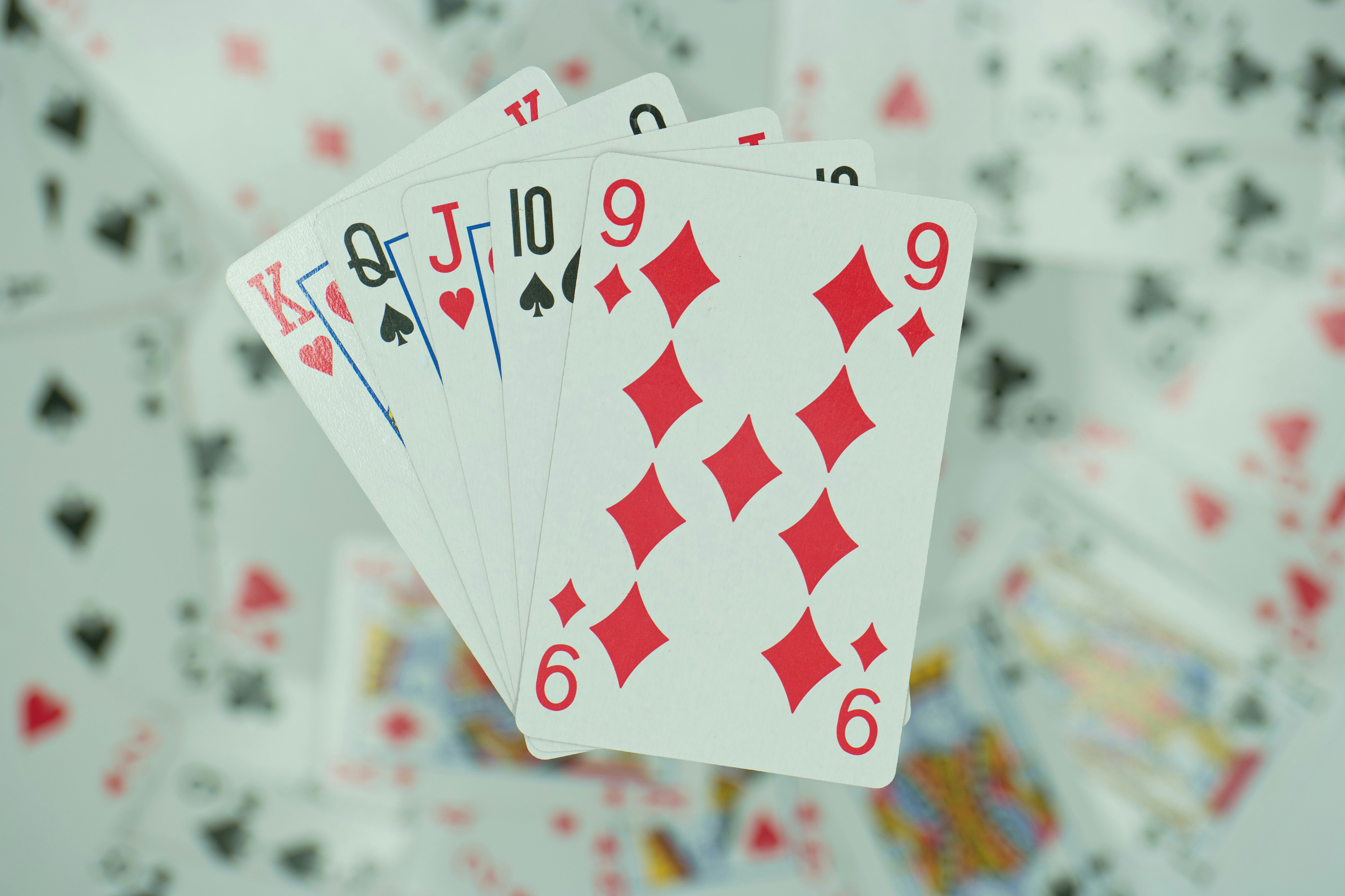 four of a kind of playing cards on a table