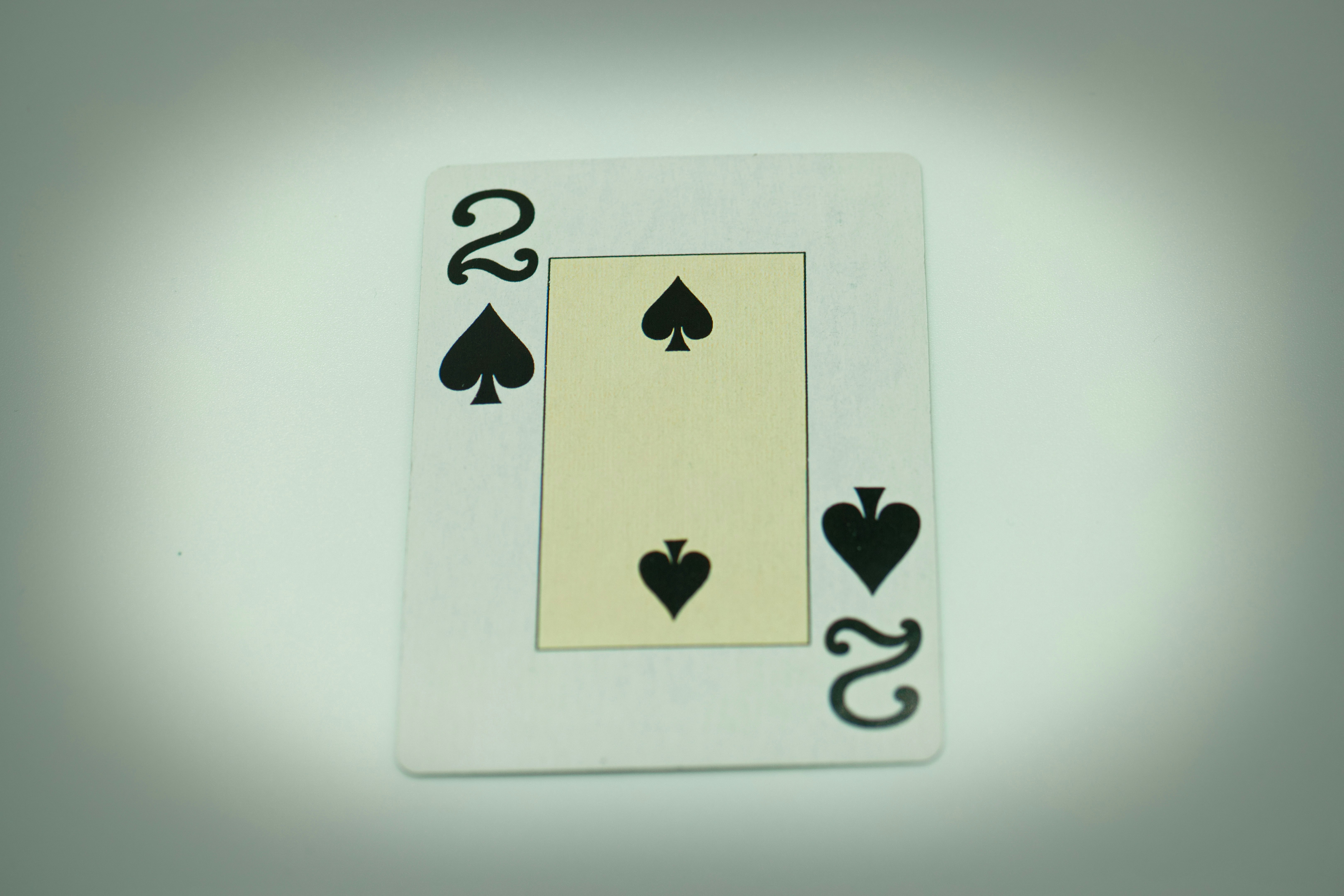 a playing card with two hearts and two spades