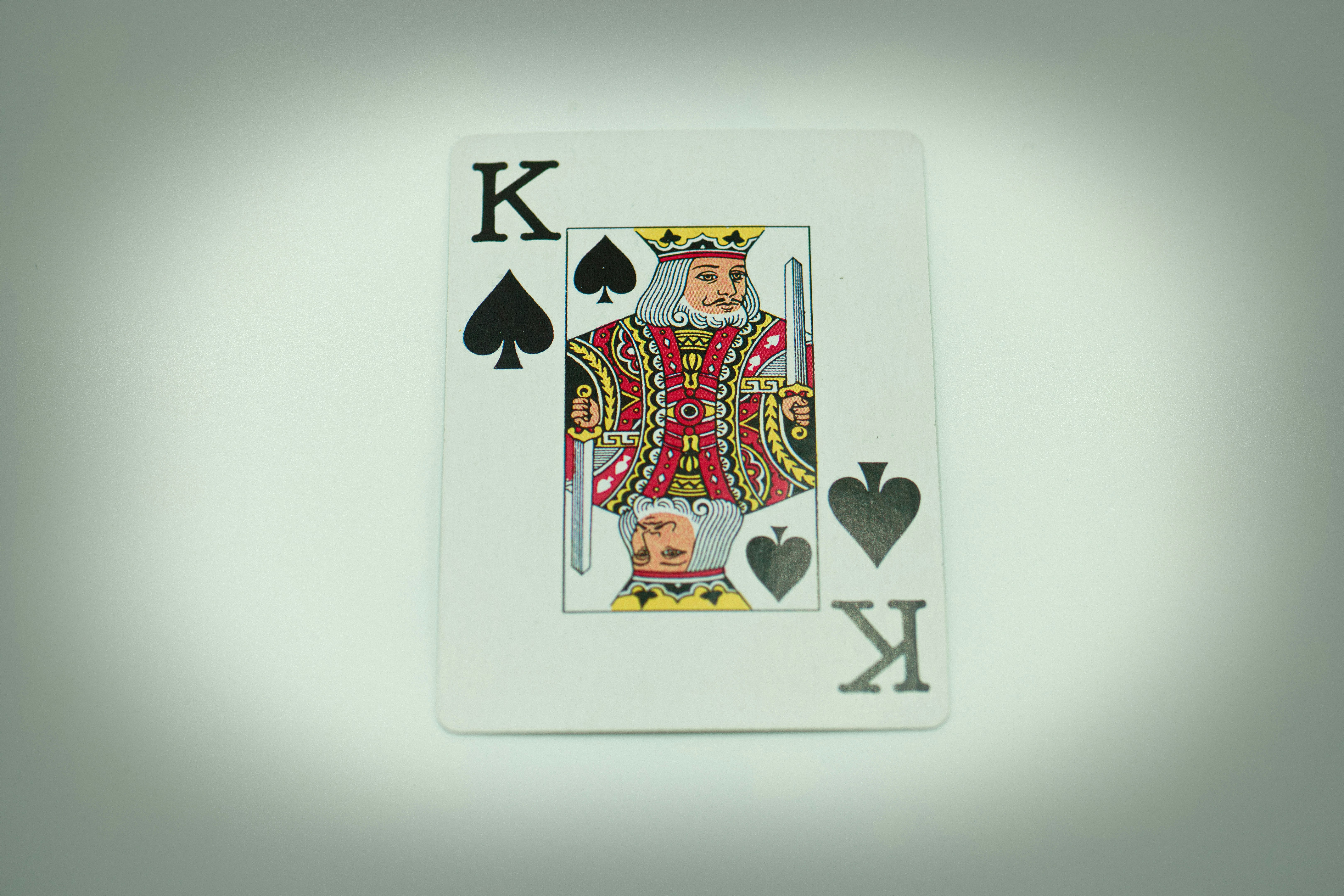 a playing card with a king of hearts on it