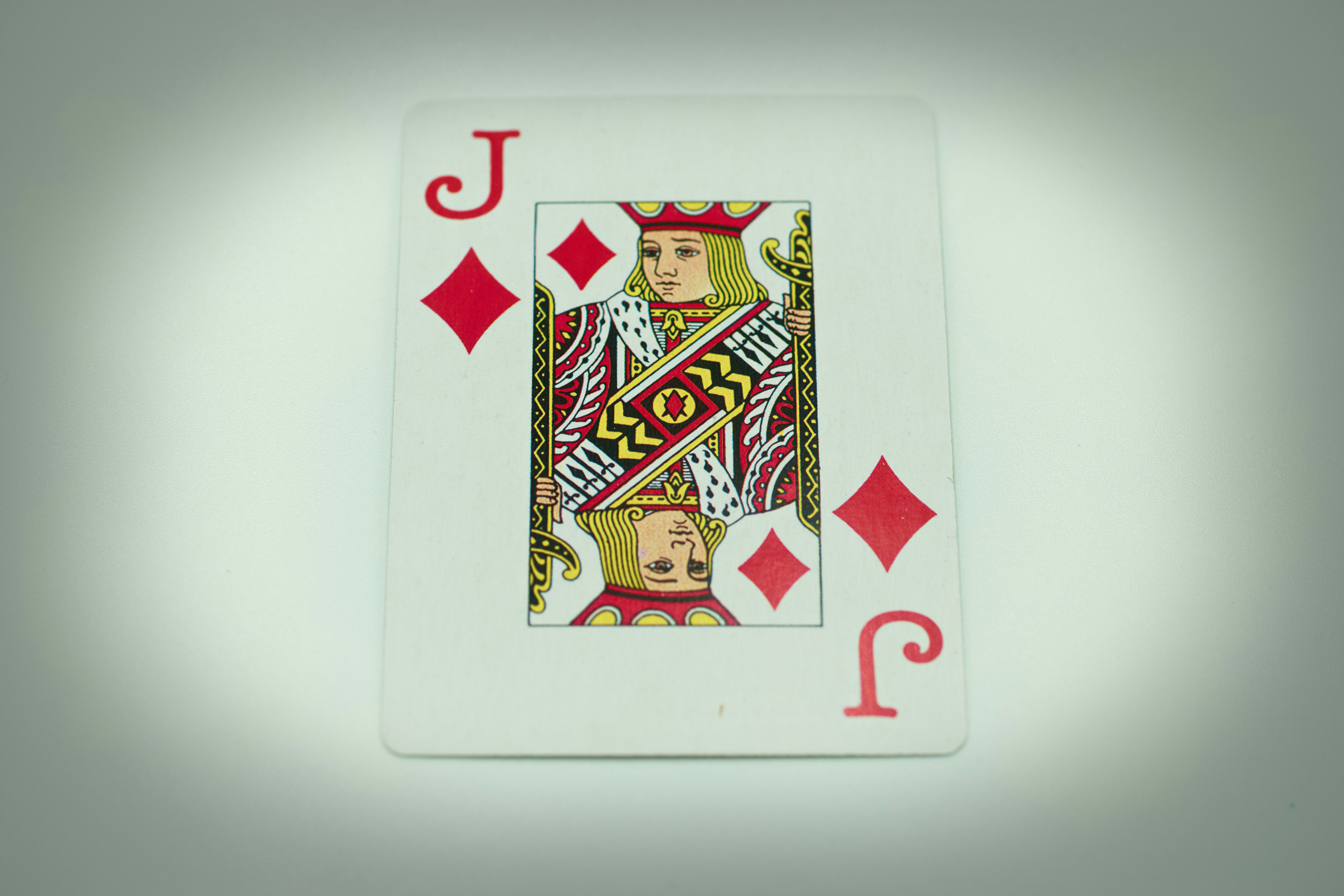 a playing card with the queen of spades on it