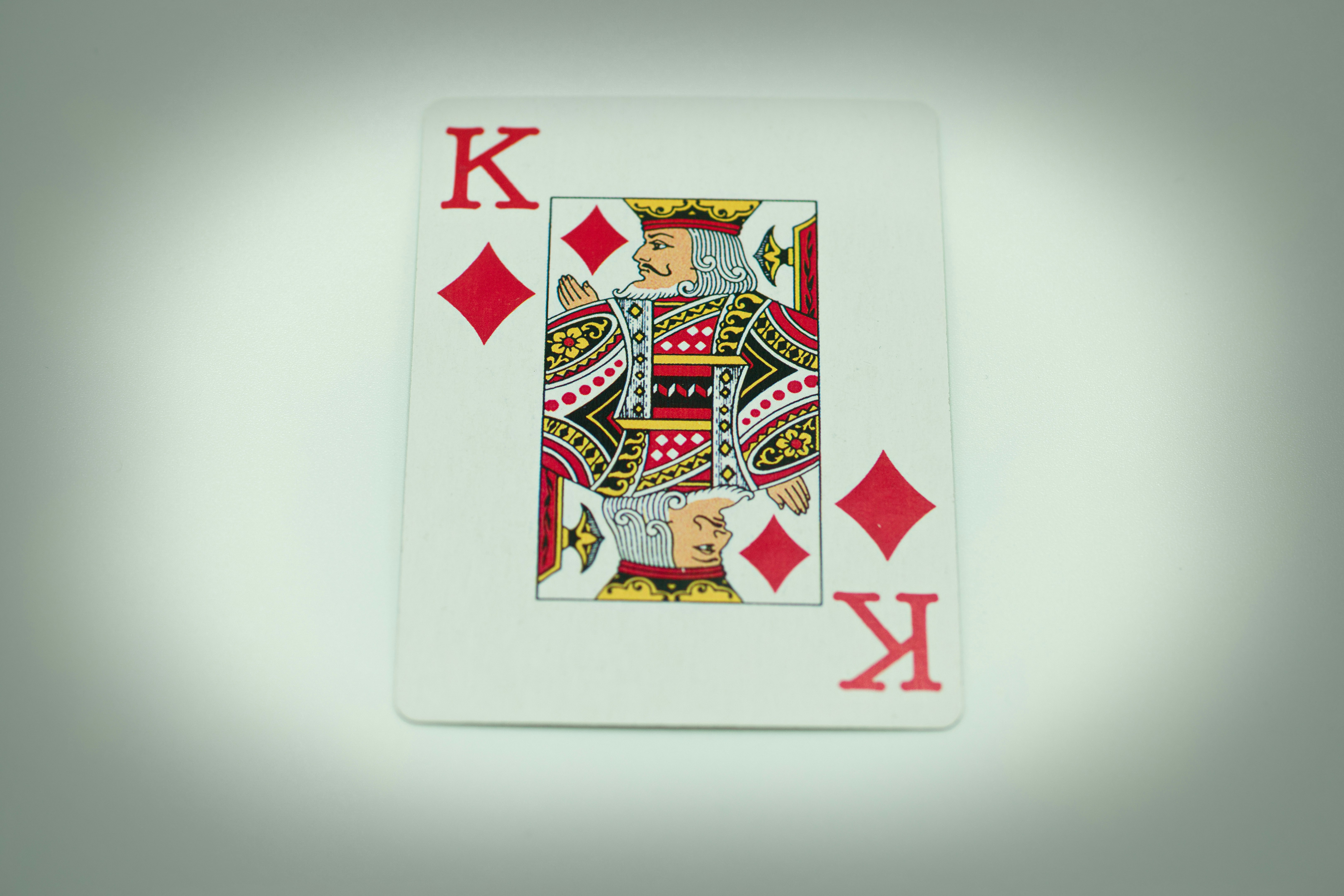 a playing card with the letter k on it