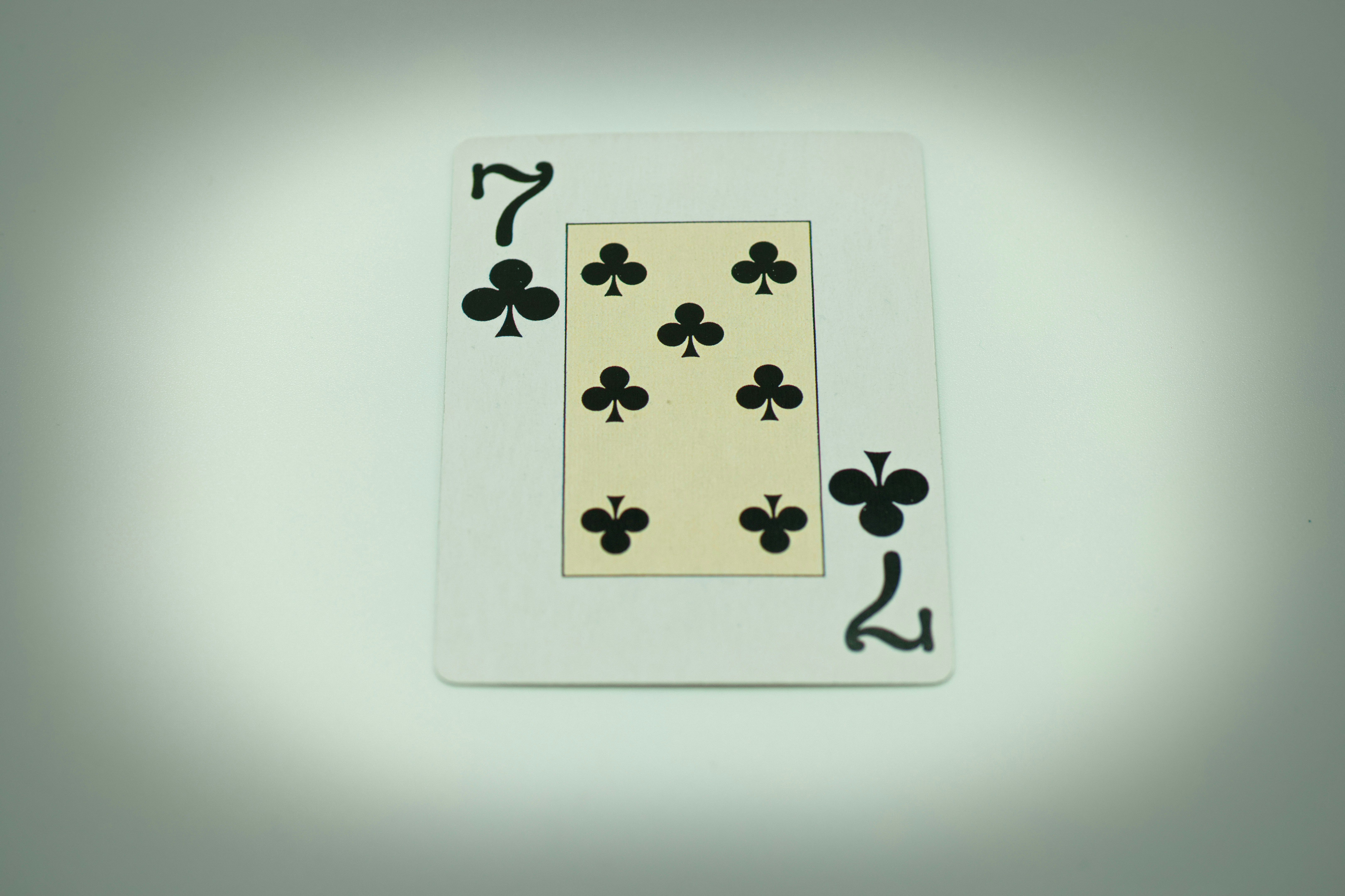 a playing card with four of spades on it