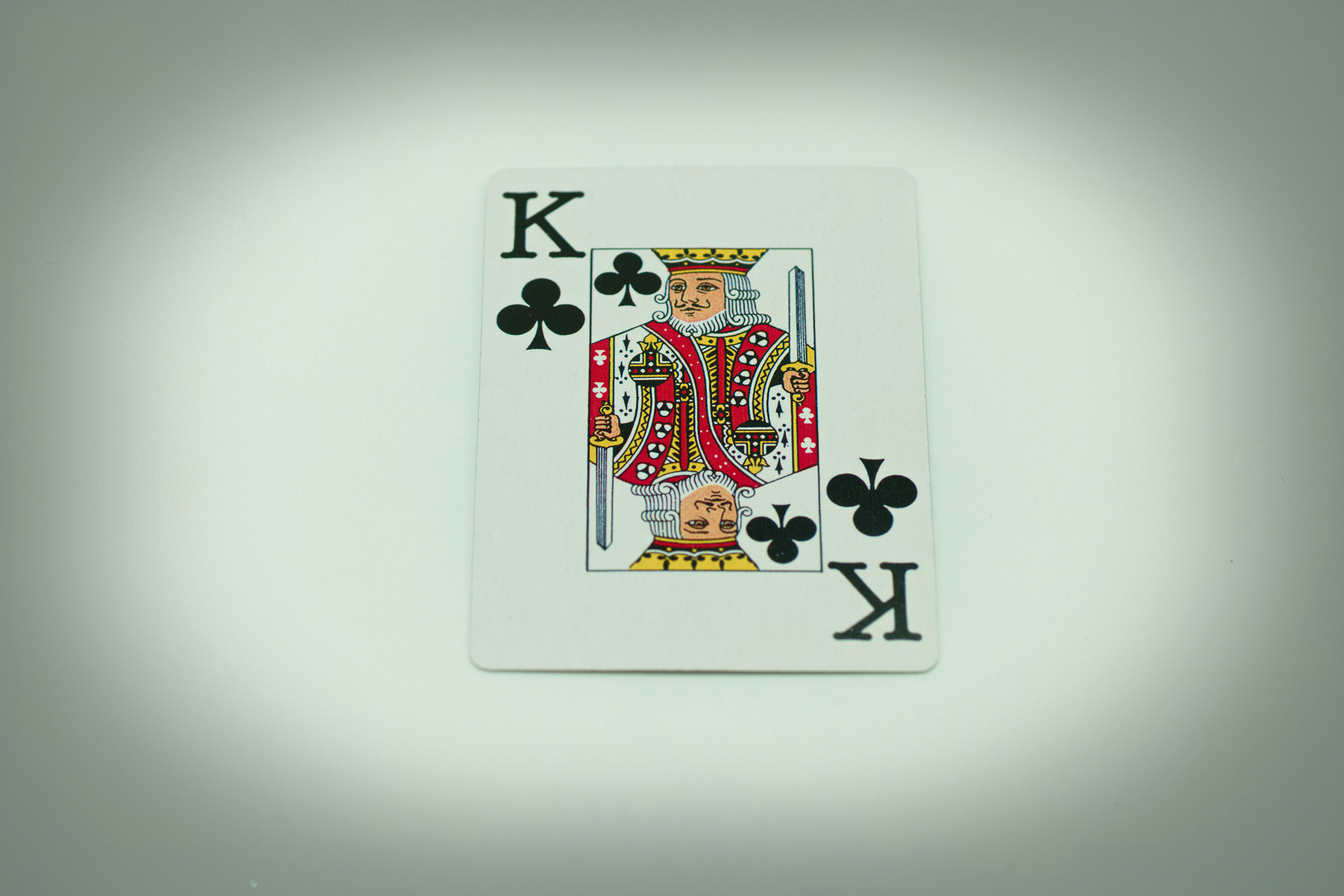 a playing card with a king of spades on it