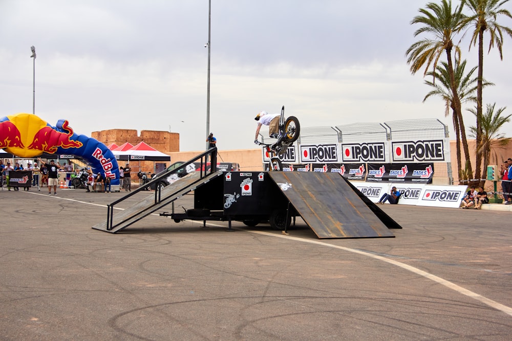 a man riding a skateboard down the side of a ramp