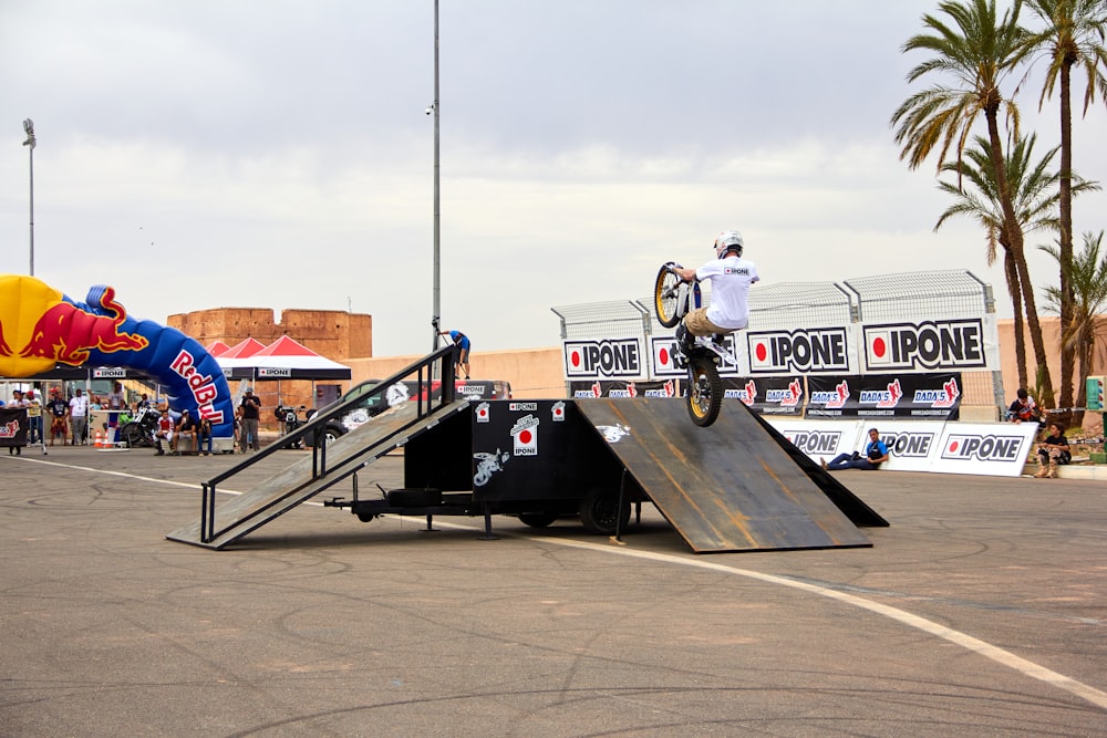 a man riding a skateboard up the side of a ramp