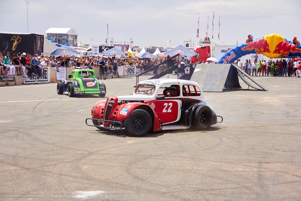 a couple of cars that are sitting in the dirt