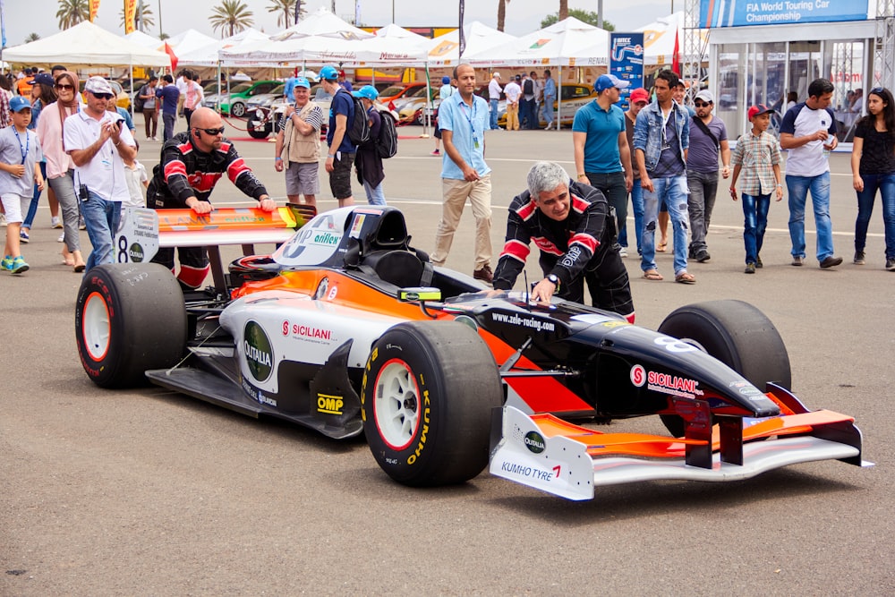 a man in a race car on a race track