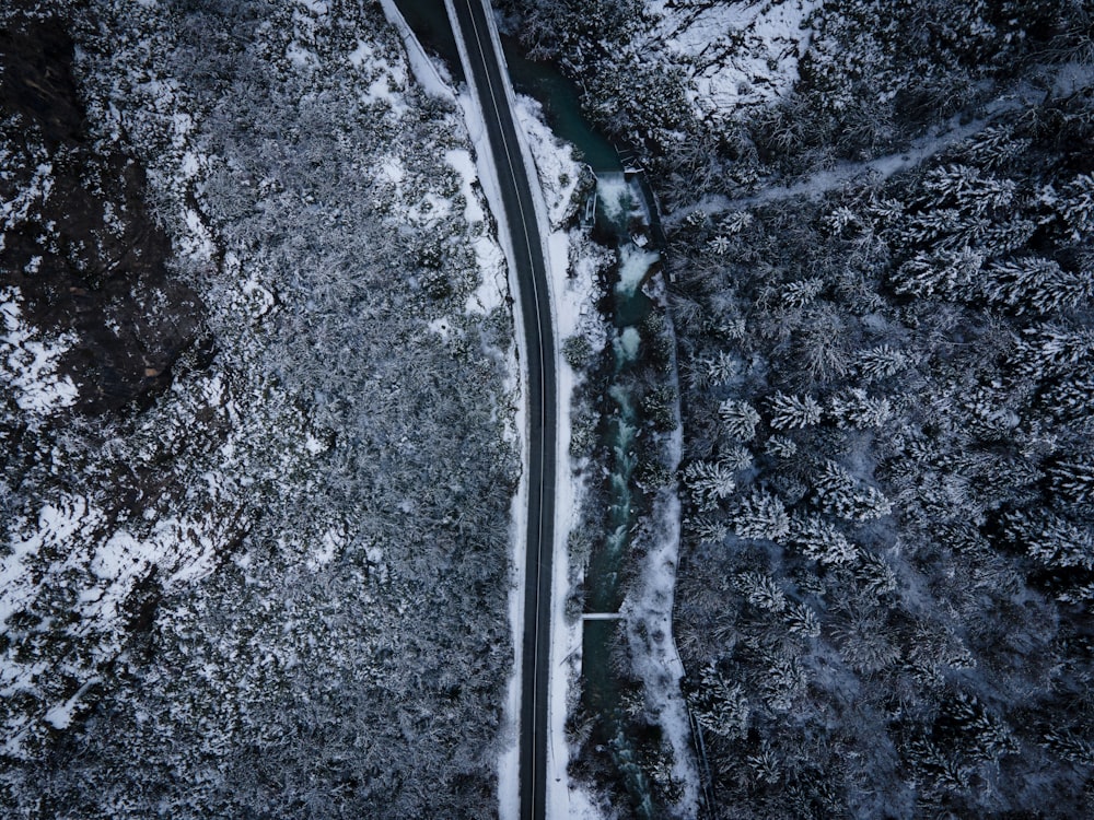 an aerial view of a road surrounded by snow