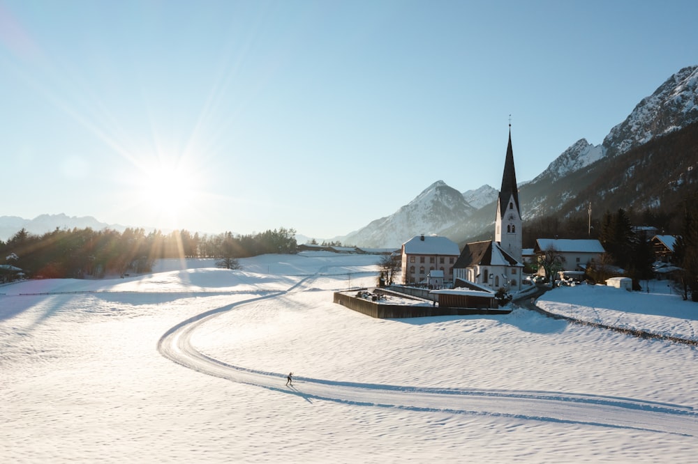 a church in the middle of a snowy landscape