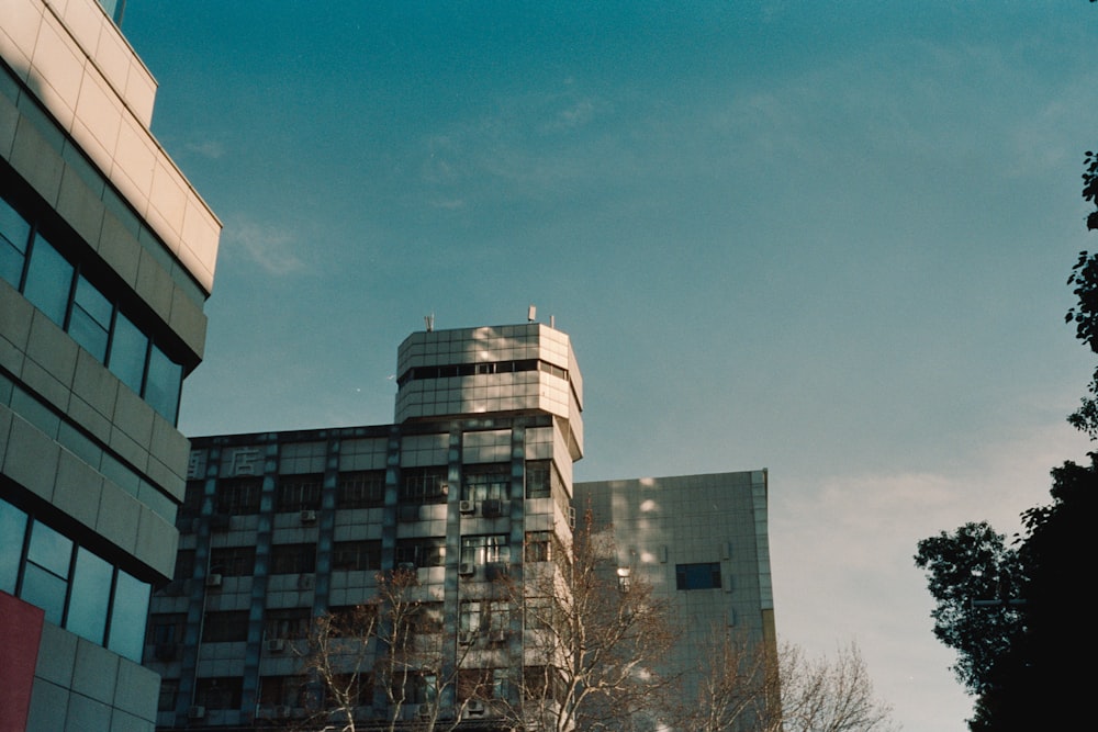 a tall building sitting next to a tall building