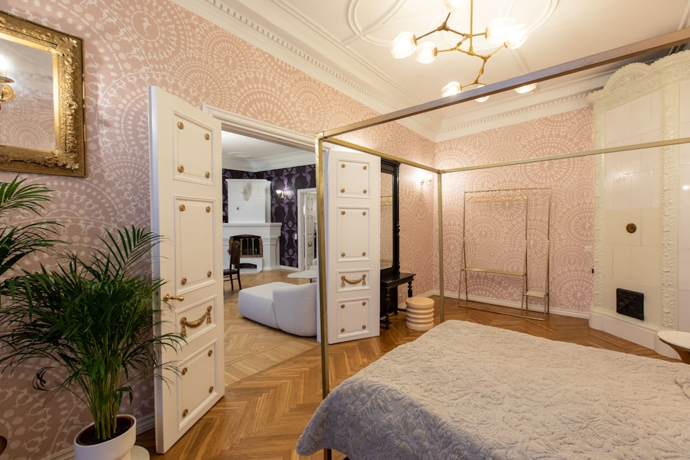 a bedroom with a bed and a mirror on the wall