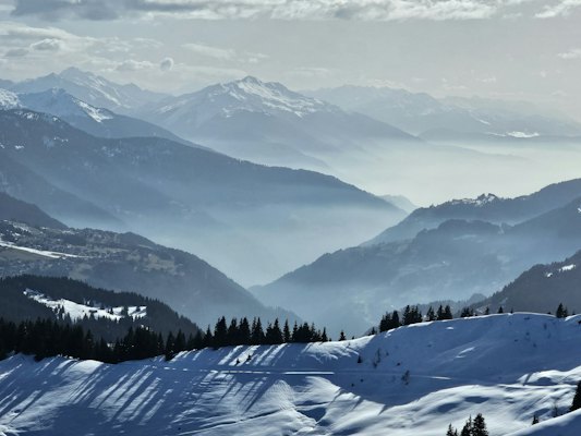 Valleys in winter mist below the slopes — Megève, France
