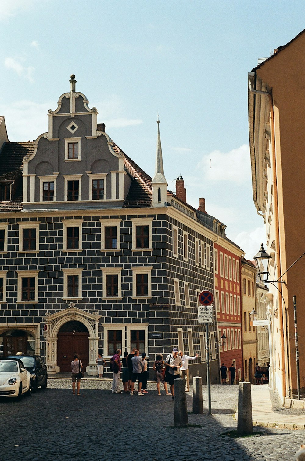 a group of people standing in front of a building