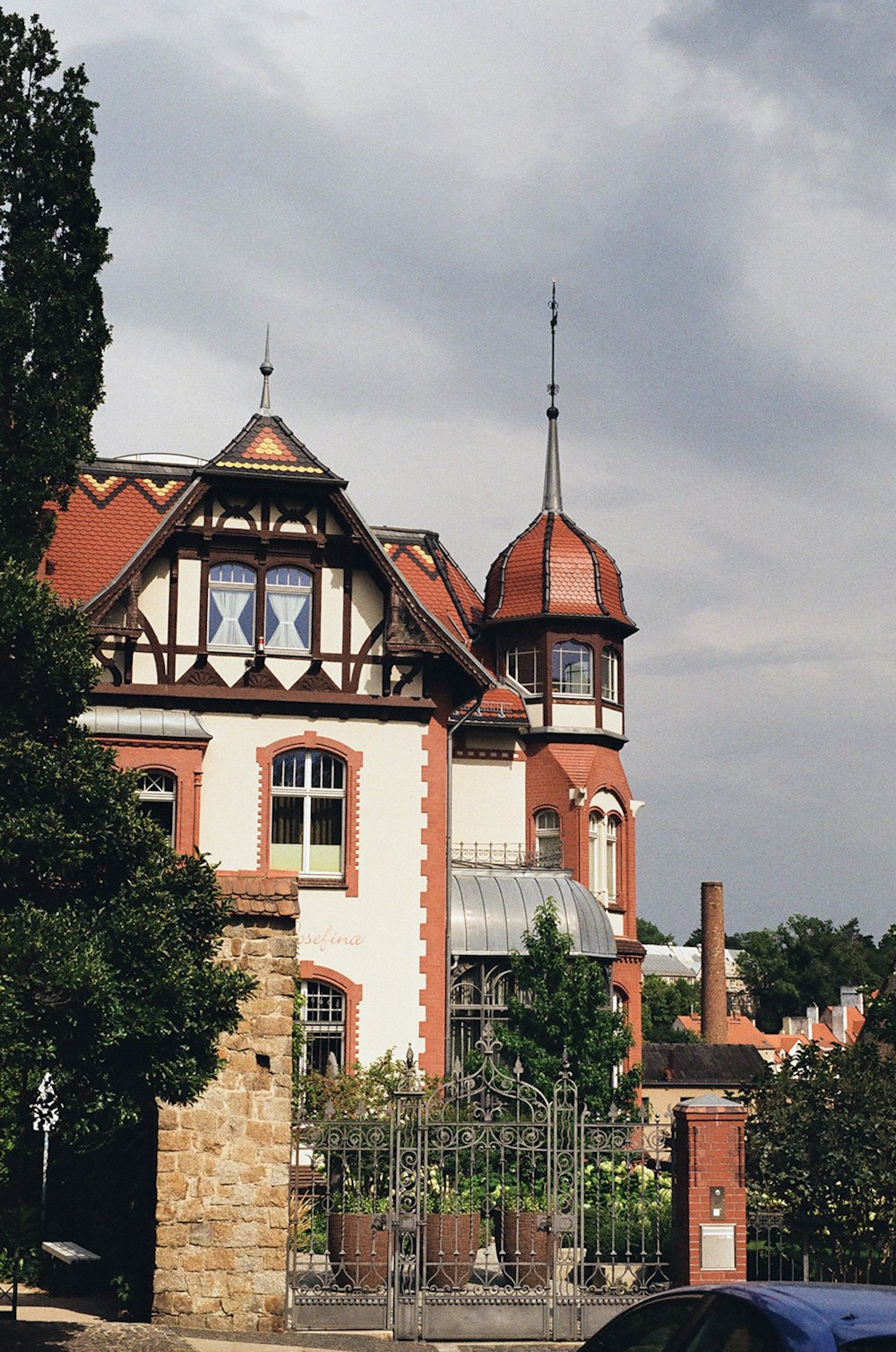 a car is parked in front of a large building