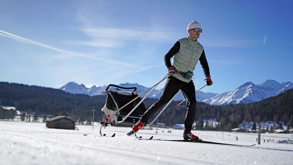 a man riding skis down a snow covered slope