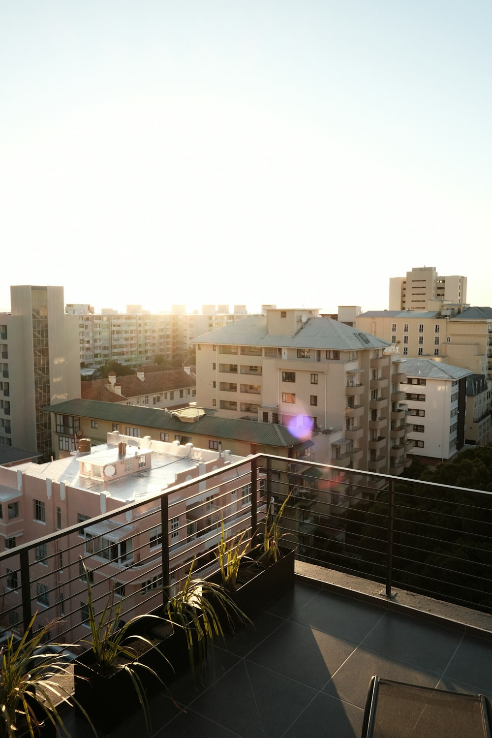 a balcony with a view of a city