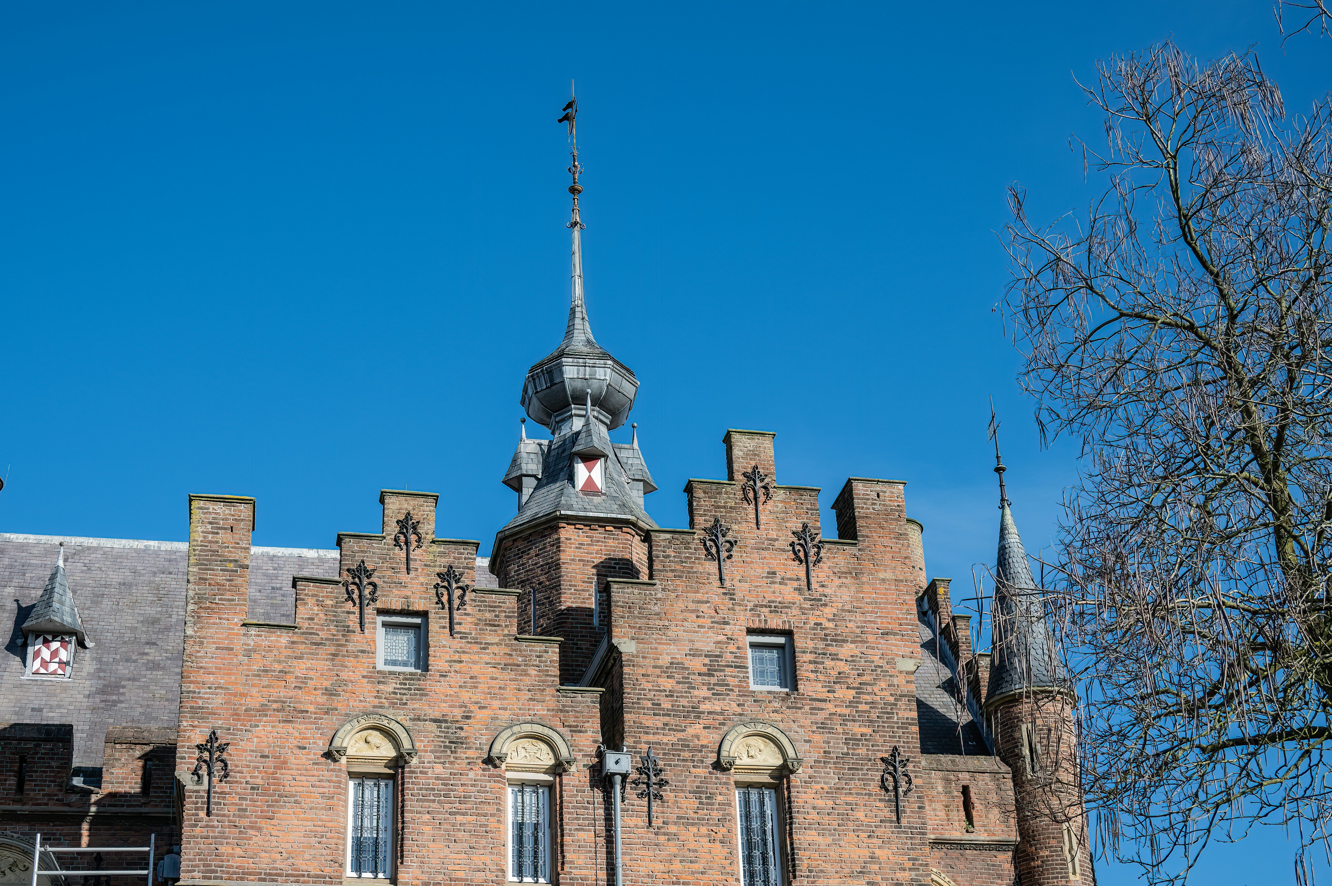 a tall brick building with a clock tower