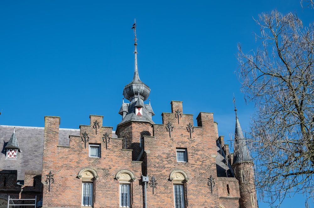 a tall brick building with a clock tower