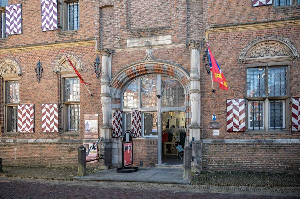 a large brick building with a clock on the front of it