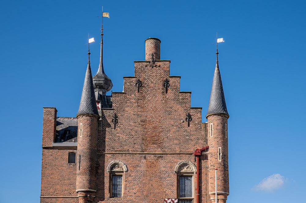 a very tall brick building with two towers