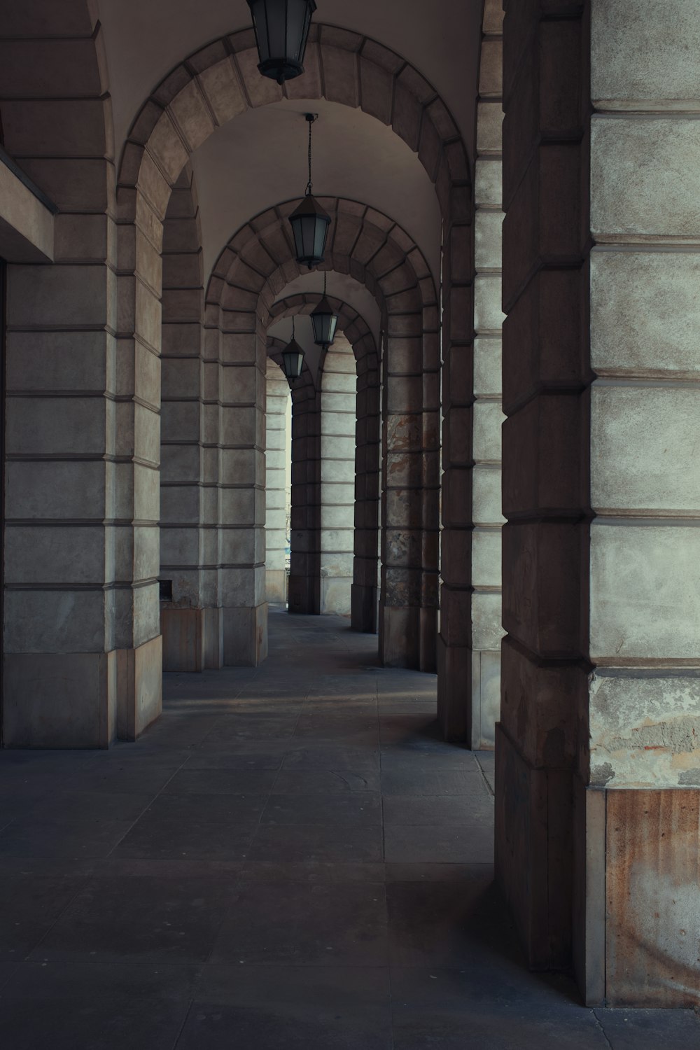 a long hallway with a light hanging from the ceiling