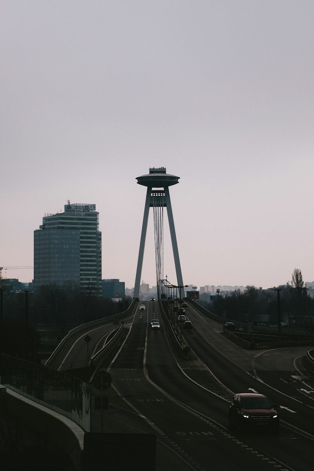 a highway with a tower in the middle of it